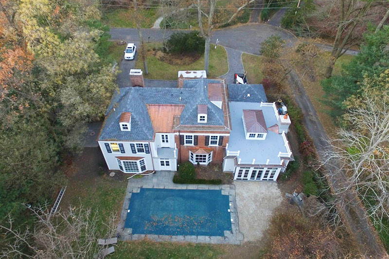 GAF shingles, custom made copper pole gutters and metal roof systems on a home in Bryn Mawr.