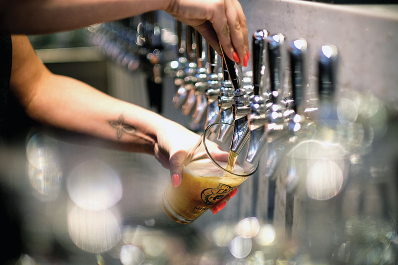 One of 33 taps in action at Taphouse 23. 